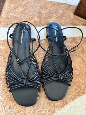 Anthropologie black Strappy size eight ankle closure sandals